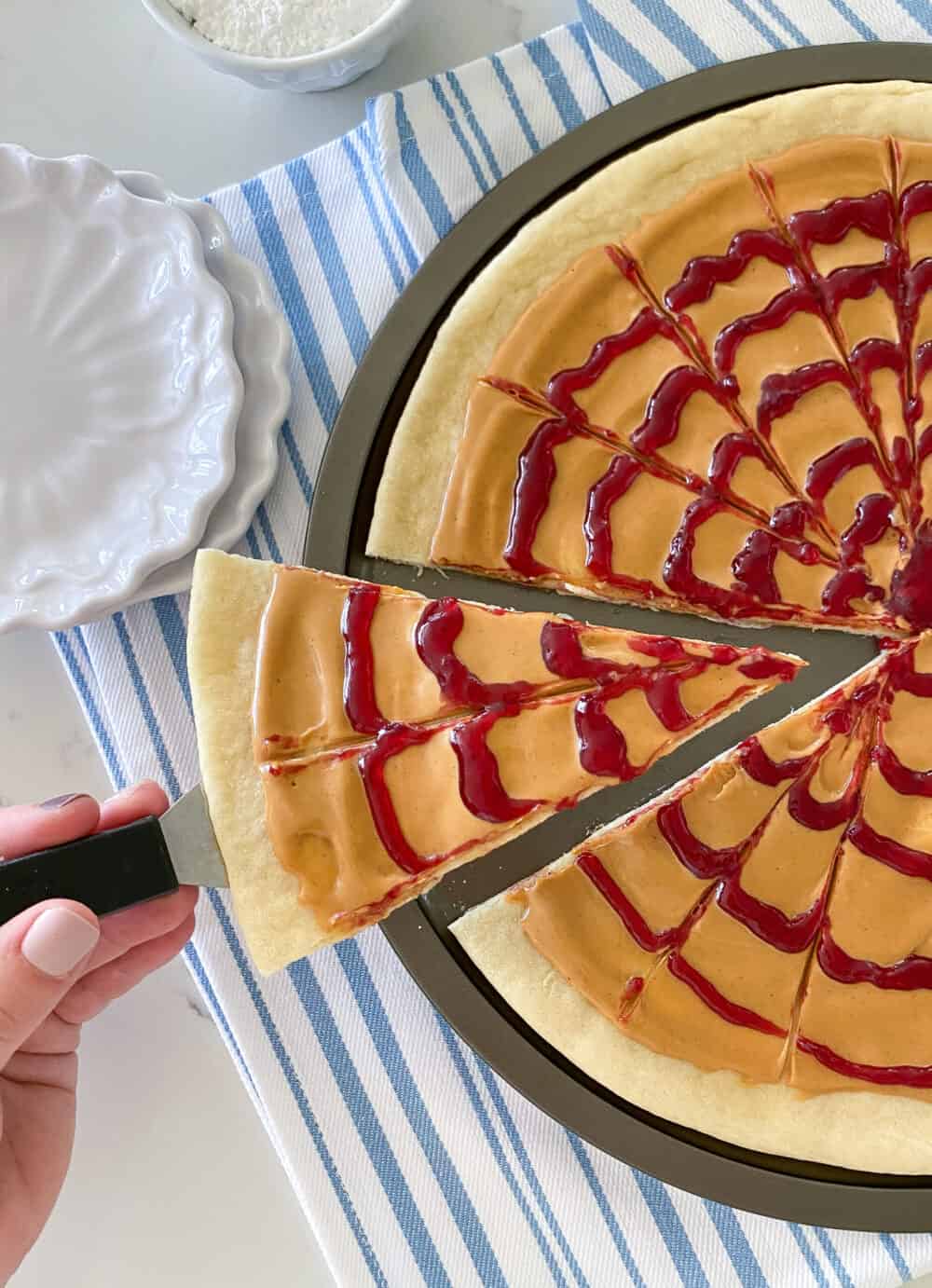 peanut butter and jelly pizza on pizza pan