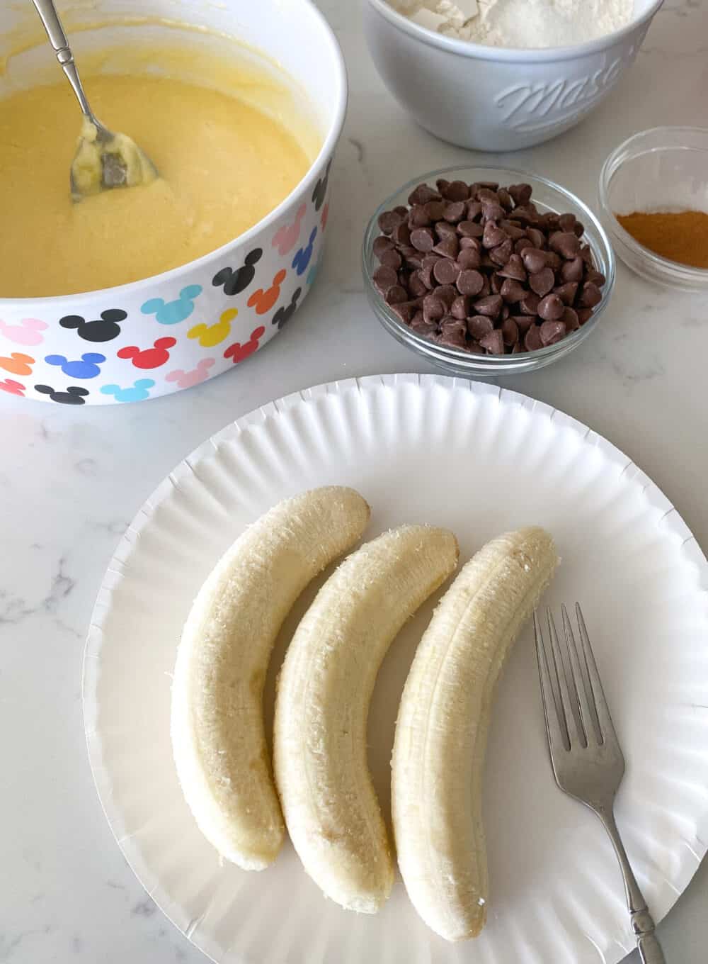 mashing bananas for chocolate chip banana bread