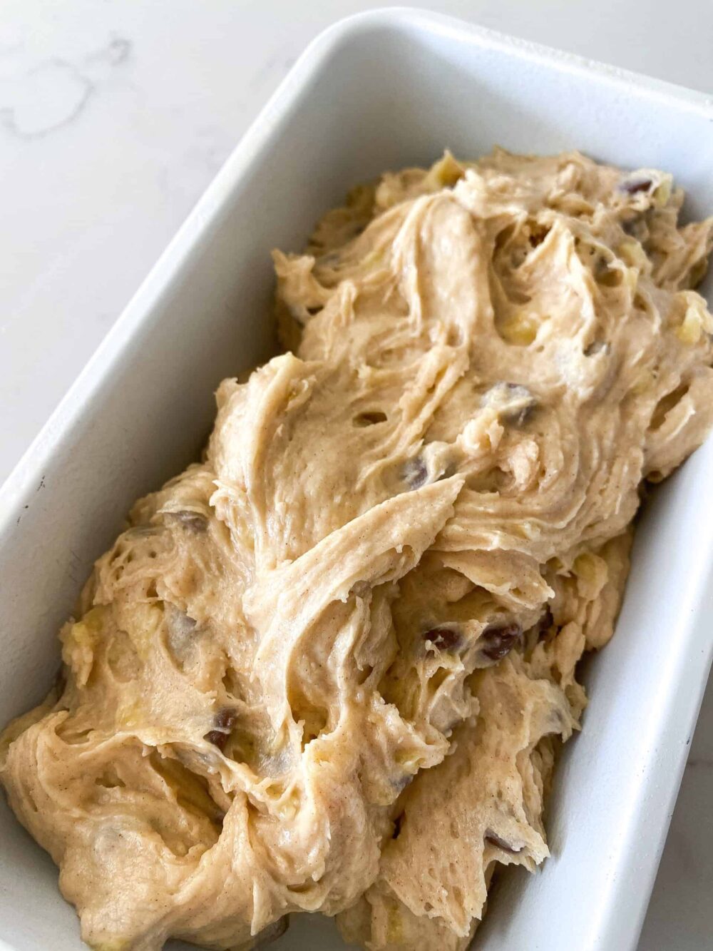 banana bread batter in loaf pans