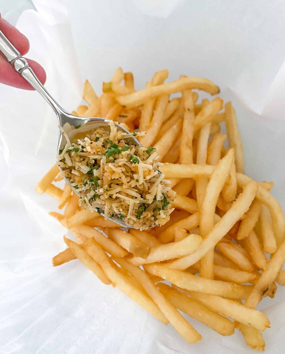 top pommes frites with Parmesan mixture