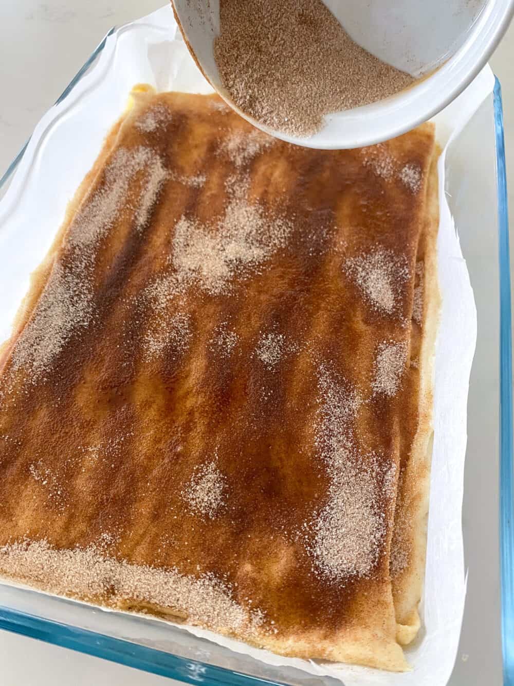 topping cheesecake bars with cinnamon sugar