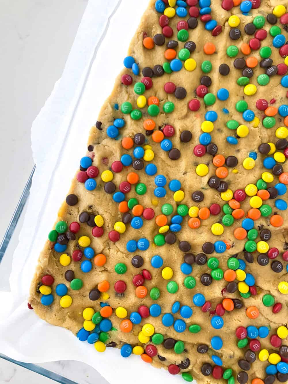 transfer cookie dough to pan for m&m cookie bars