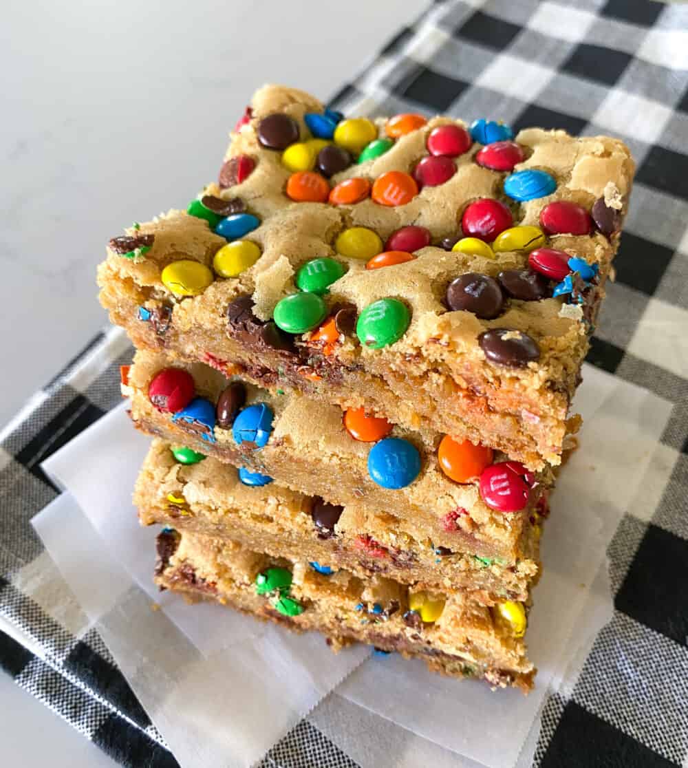 baked m&m cookie bars cut into squares