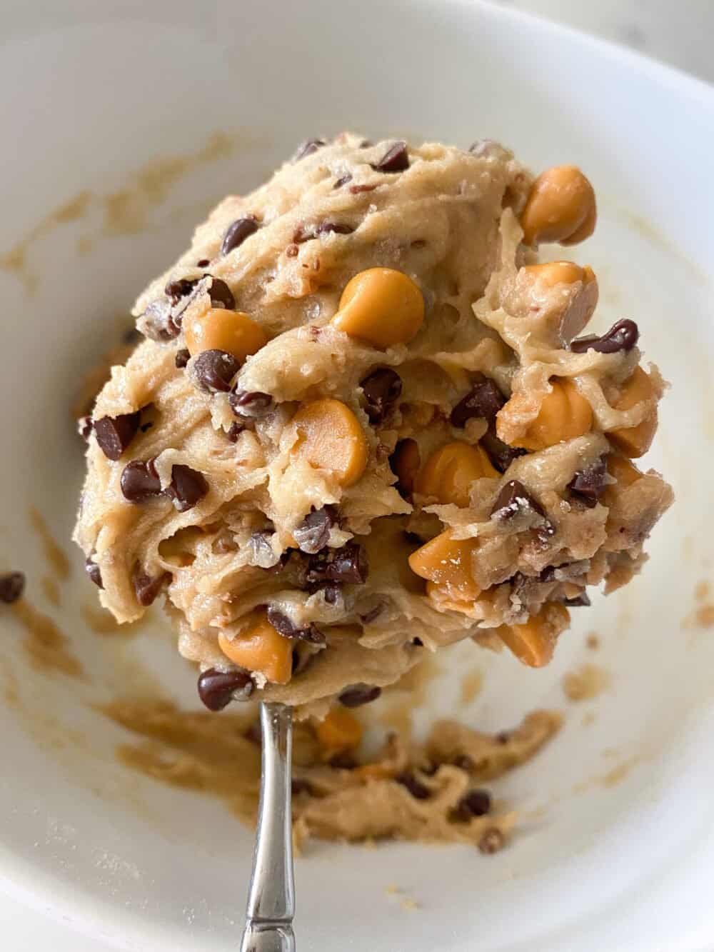 giant chocolate chip cookie dough in mixing bowl