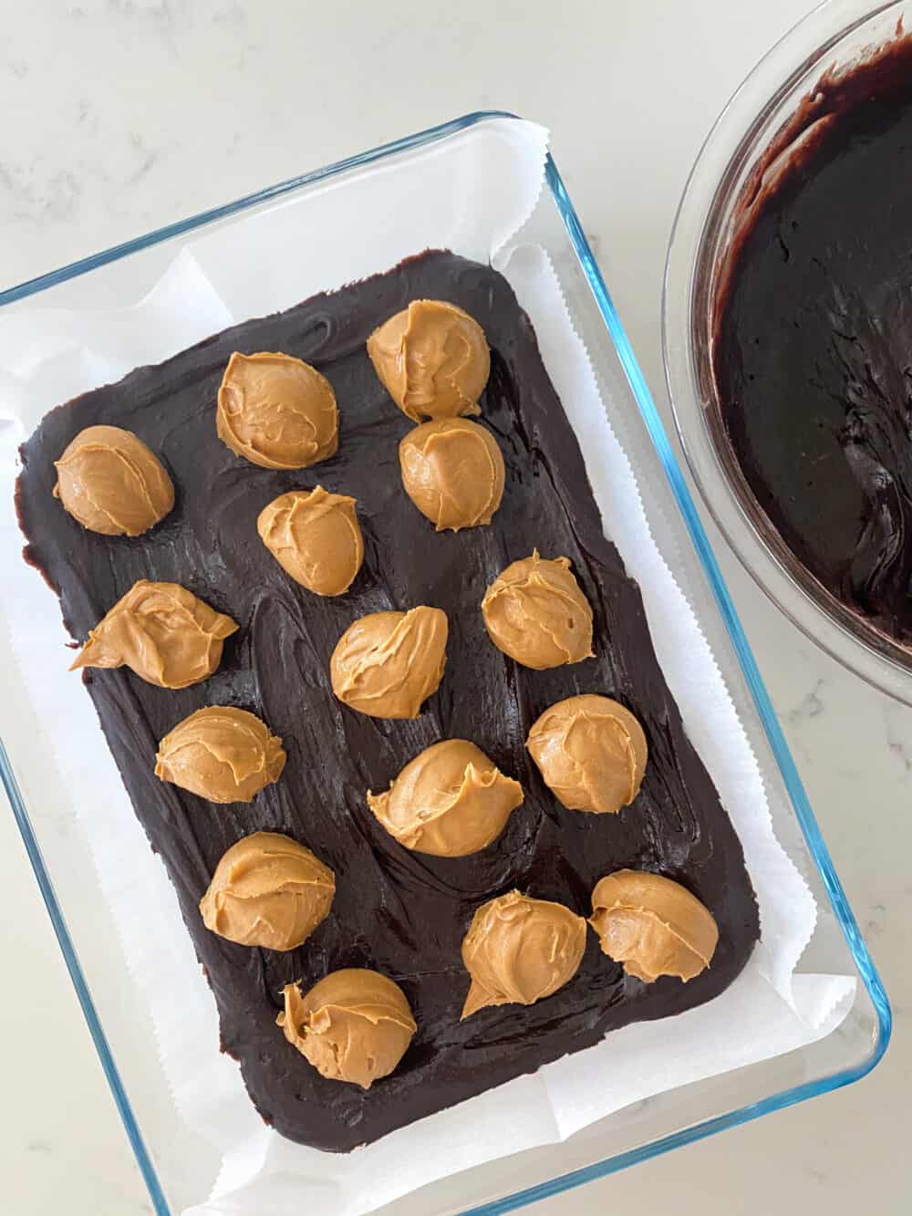 adding peanut butter to peanut butter brownies