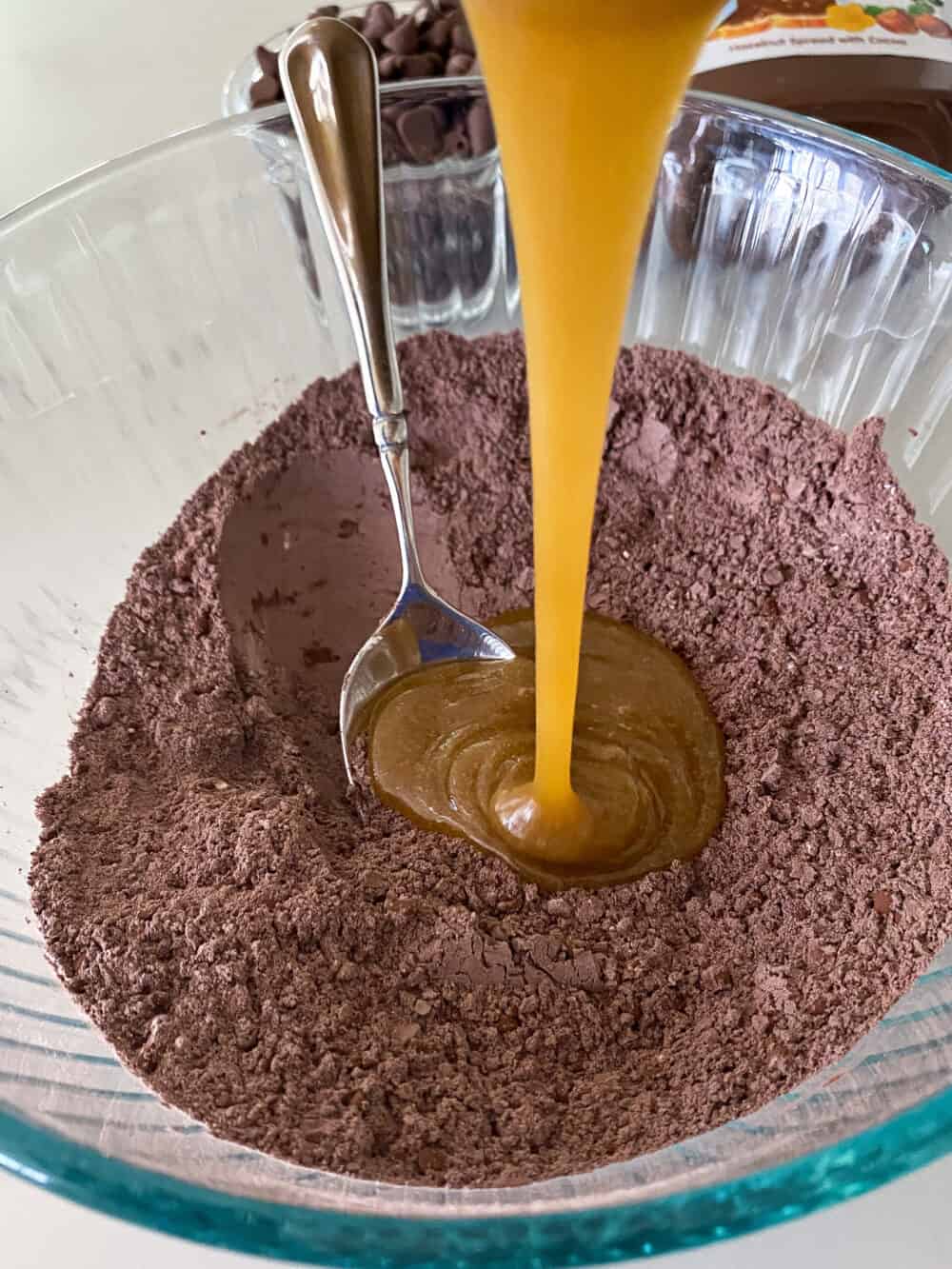 wet ingredients into mixing bowl for nutella brownies