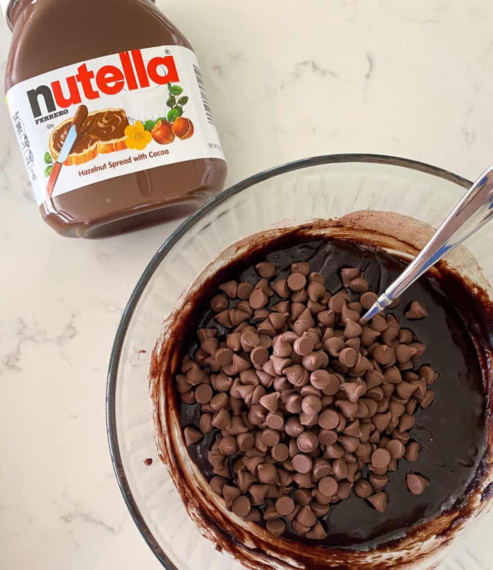 stirring in chocolate chips for nutella brownies
