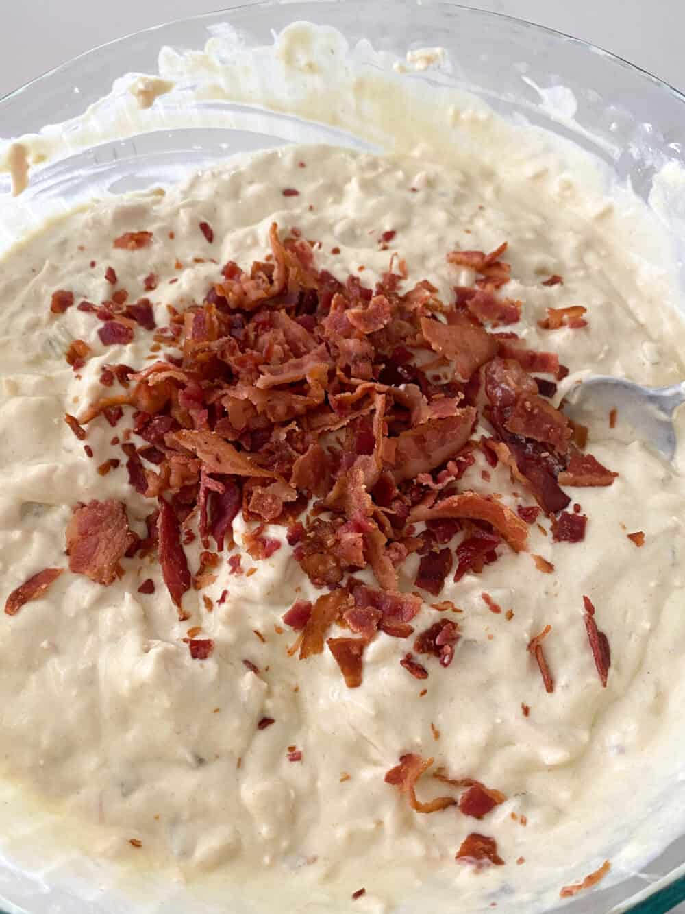 bacon crumbles added to mixing bowl