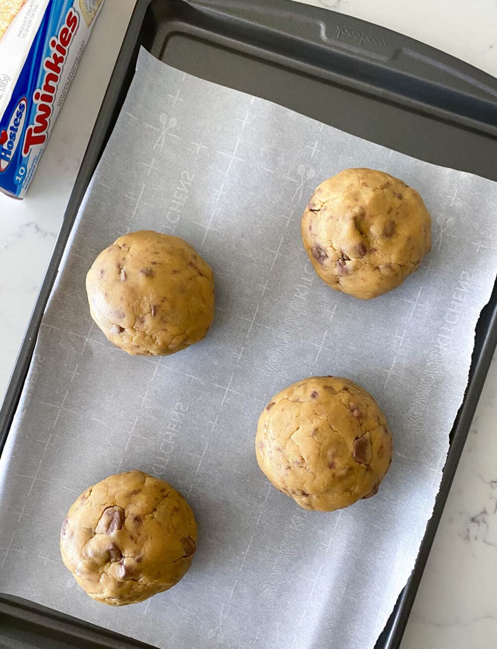 twinkie stuffed cookie dough on baking sheet