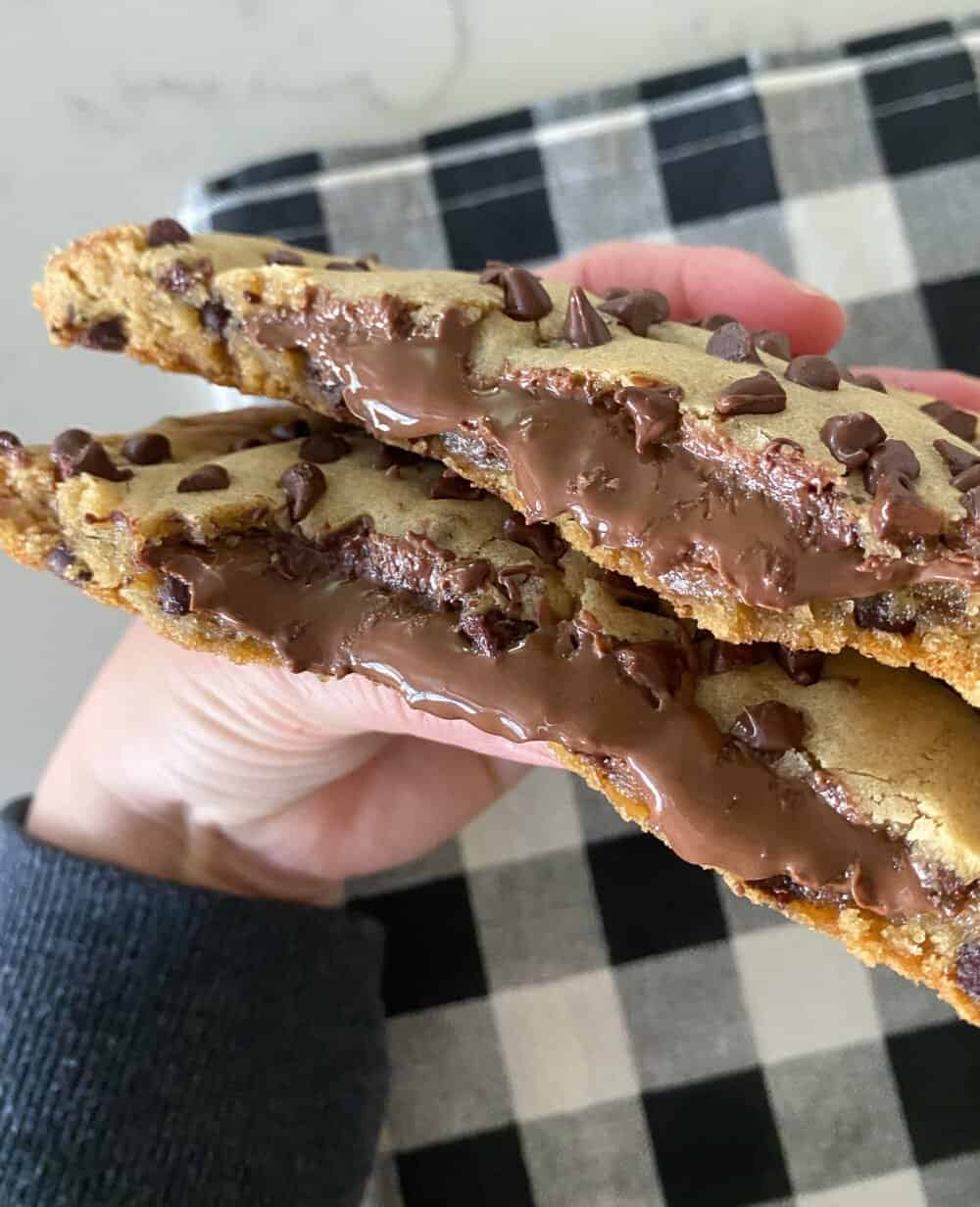 nutella stuffed cookie cut in half to show filling