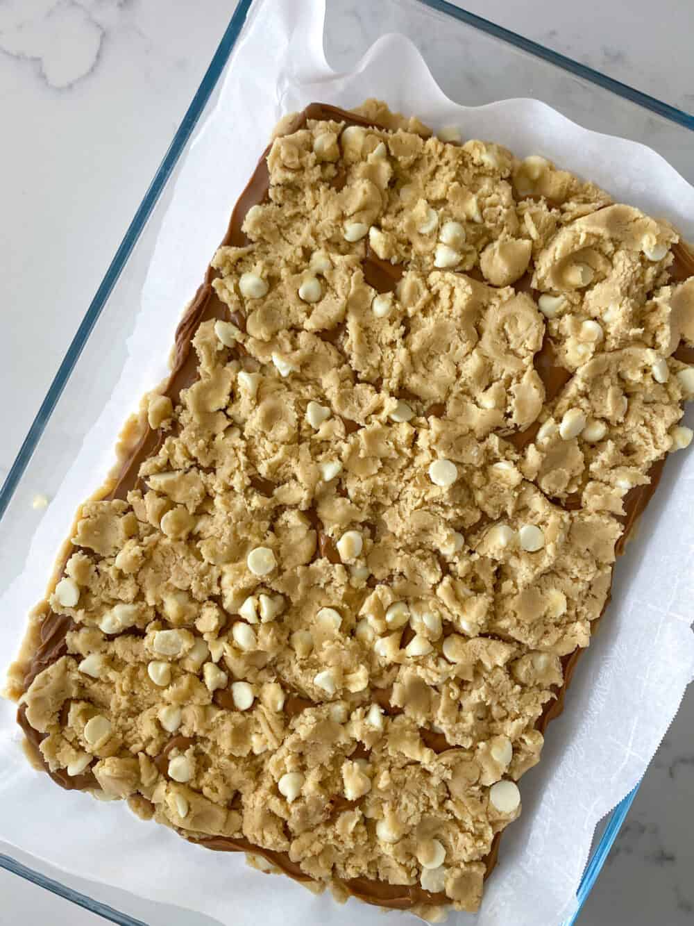 press cookie dough evenly over top in baking dish