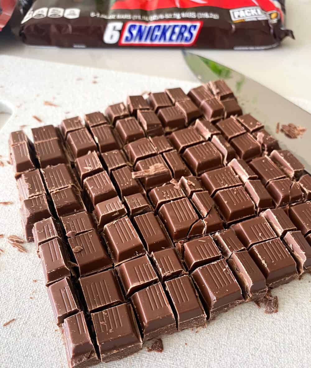 cutting snickers bars into pieces