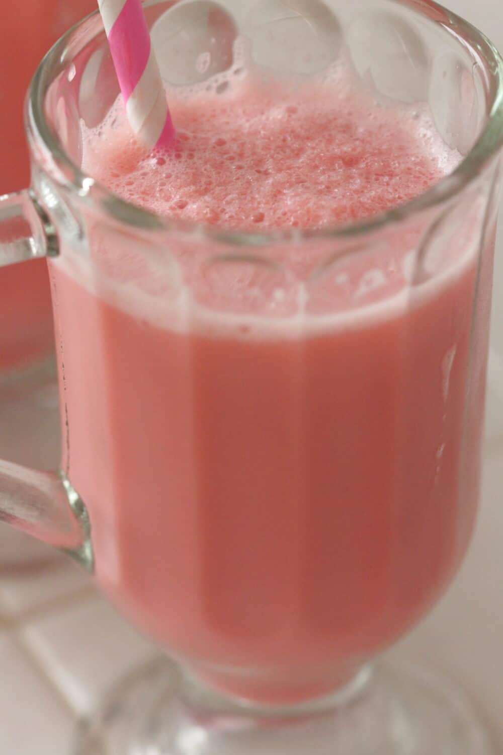 frozen strawberry milk poured in glass