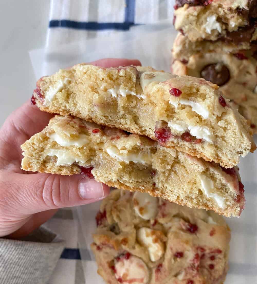 baked white chocolate chip cookies cut in half