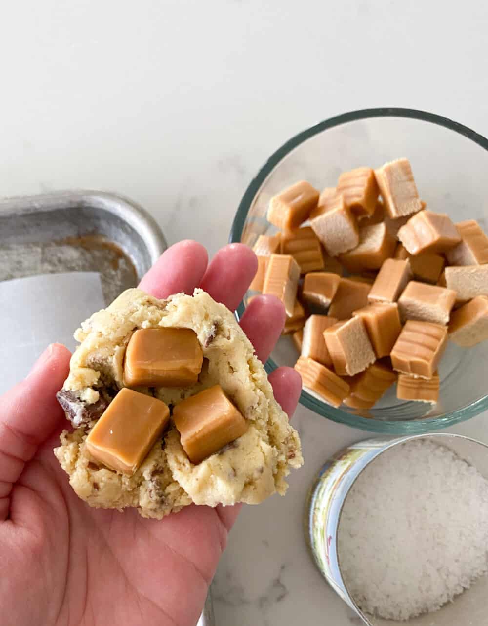 adding caramel to cookie dough for salted caramel cookies