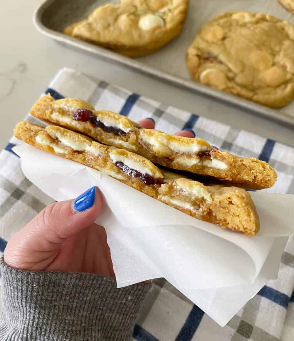 peanut butter and jelly stuffed cookies cut in half