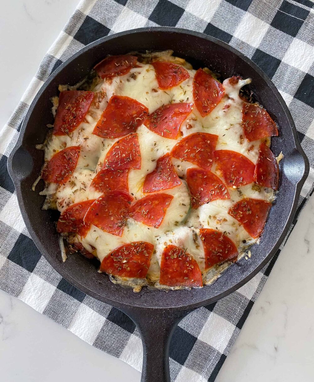 hot baked keto pizza in cast iron skillet