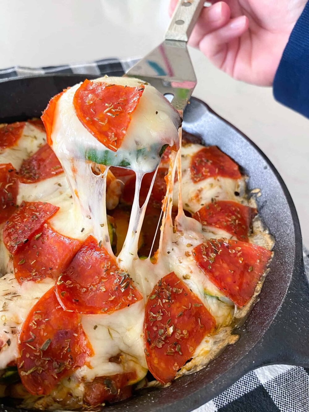 keto pizza hot served in cast iron skillet