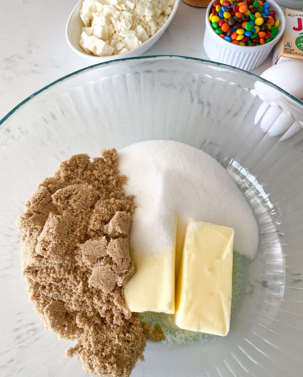 butter and sugars in mixing bowl for m&m cookies