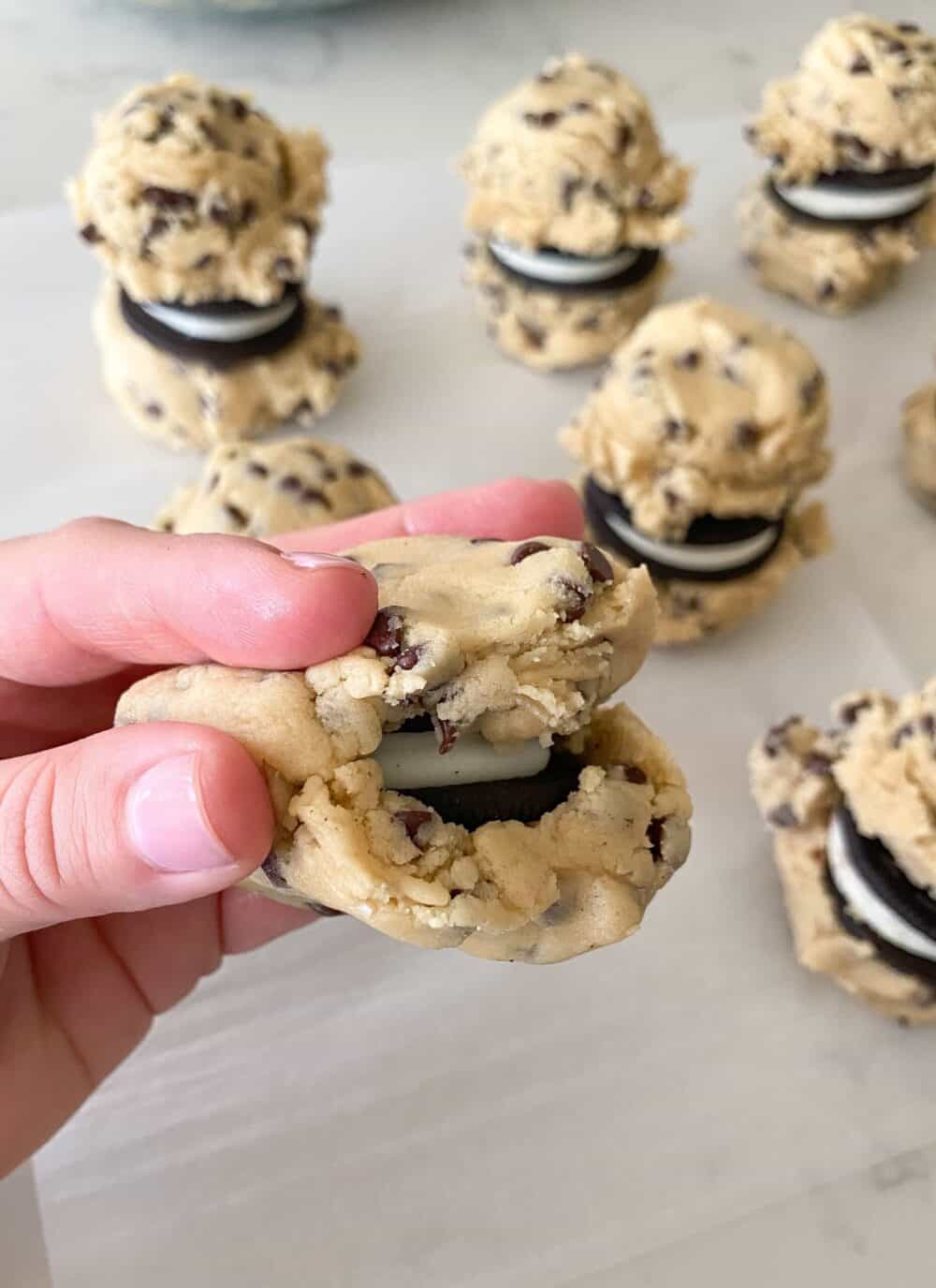 enclosing oreo cookie with cookie dough