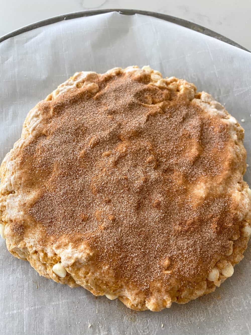 cinnamon sugar sprinkled on top of pumpkin scones