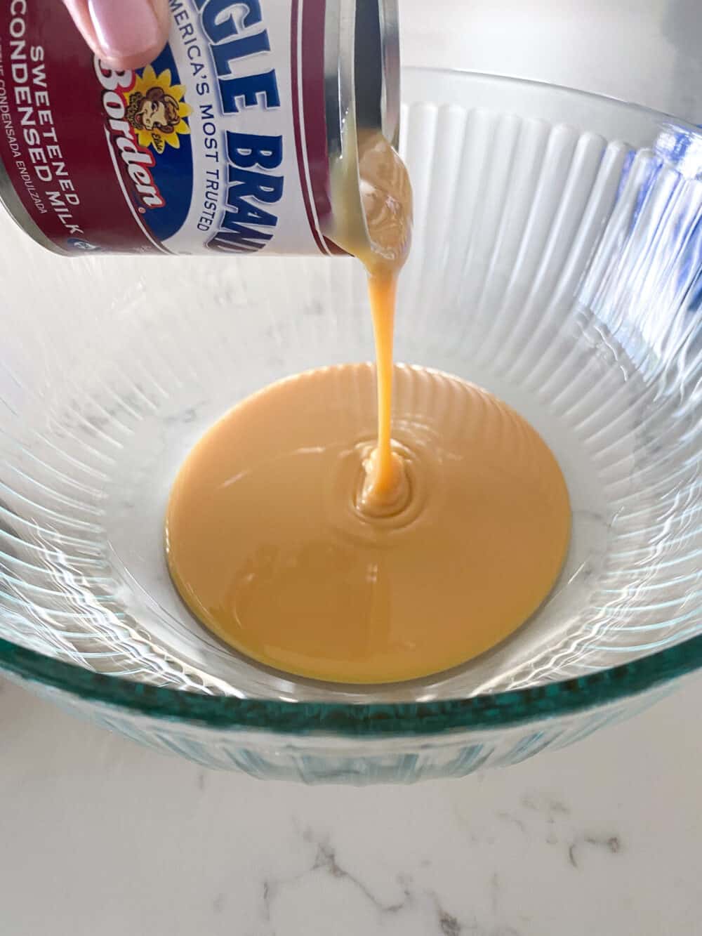 condensed milk in mixing bowl for Oreo fudge