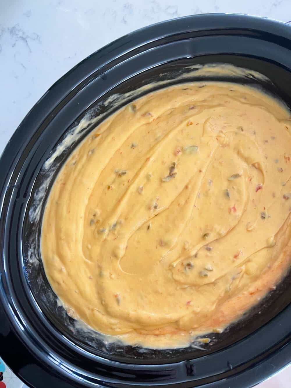 sausage added to crockpot queso recipe