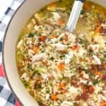 chicken orzo soup simmering in pot