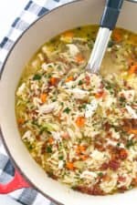 chicken orzo soup simmering in pot