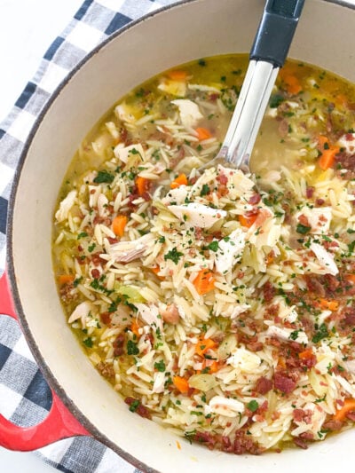 chicken orzo soup simmering in pot