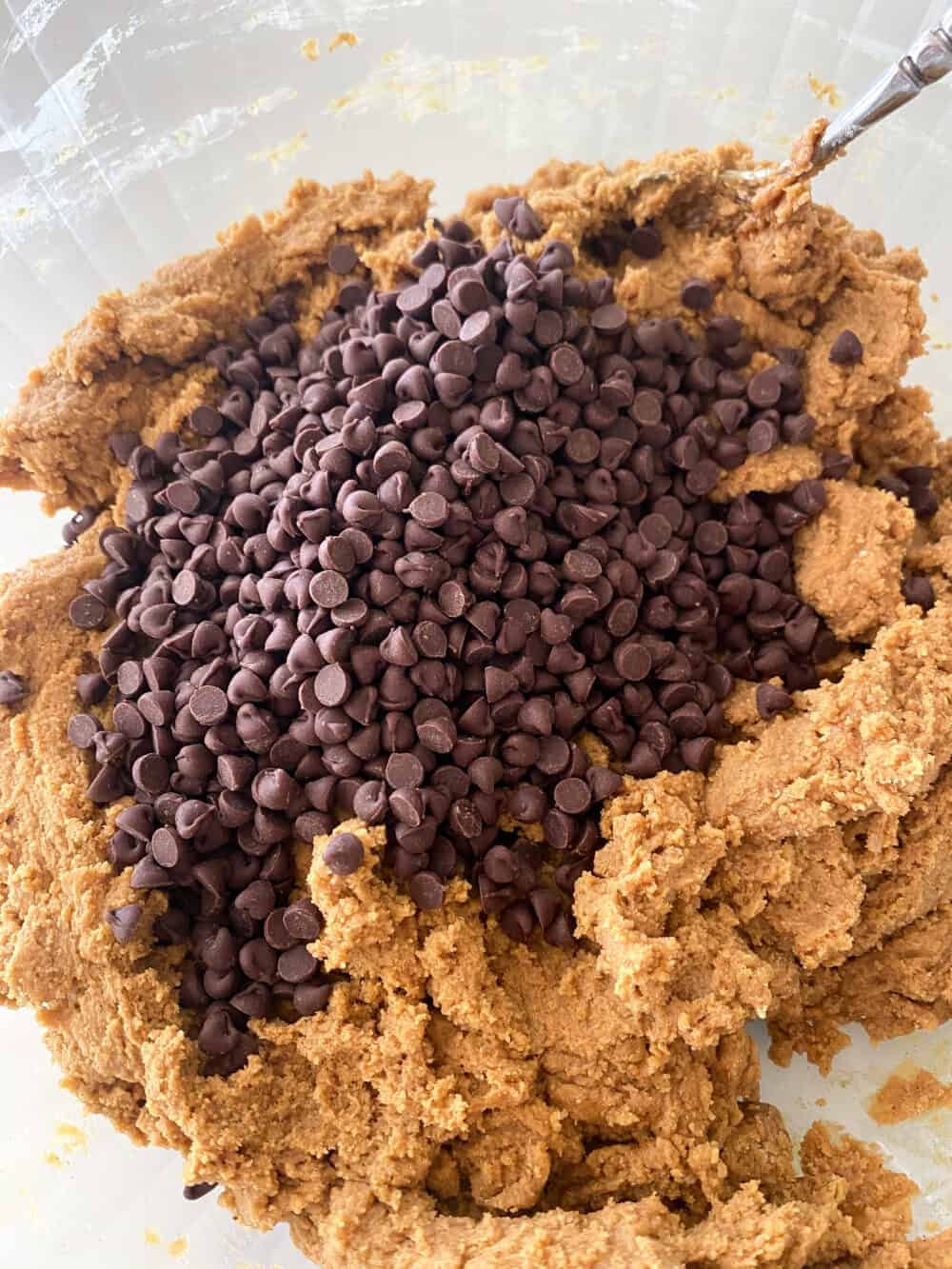 chocolate chips added in mixing bowl for gingerbread bars