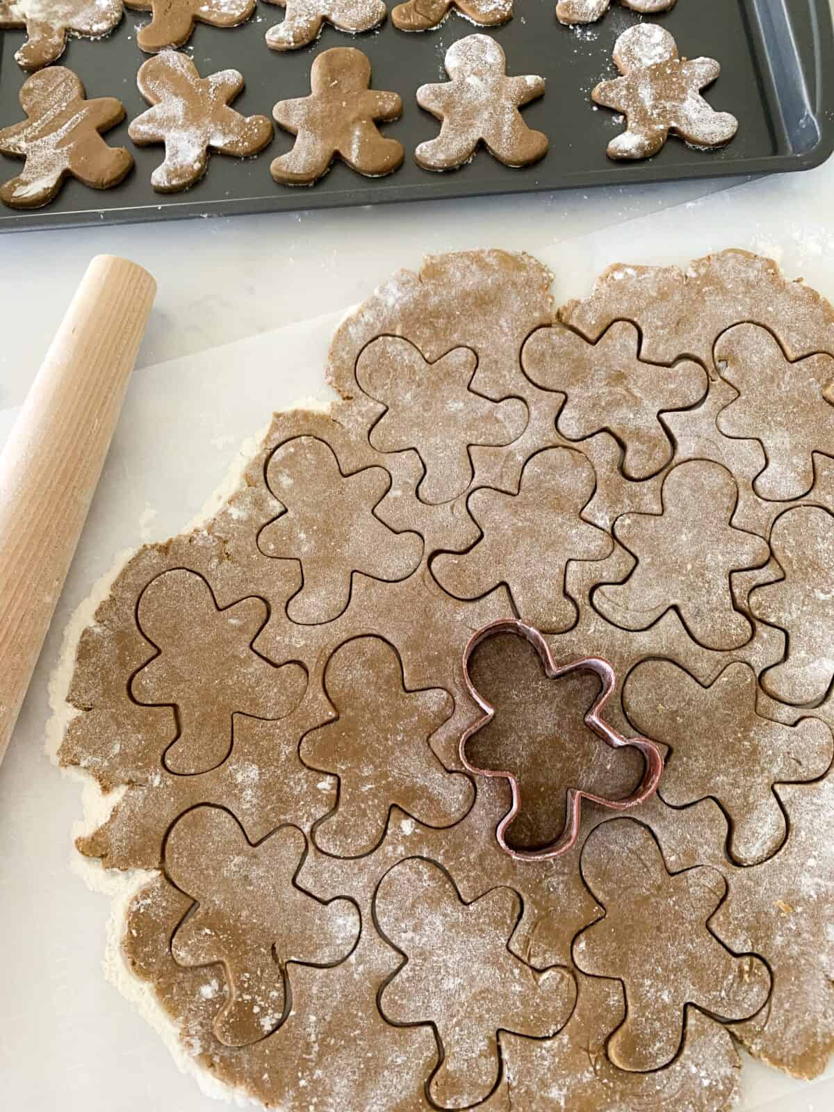 cutting gingerbread cookie man cookies
