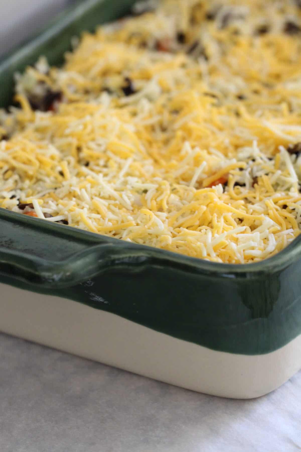 shredded cheese added to top of chicken and rice casserole