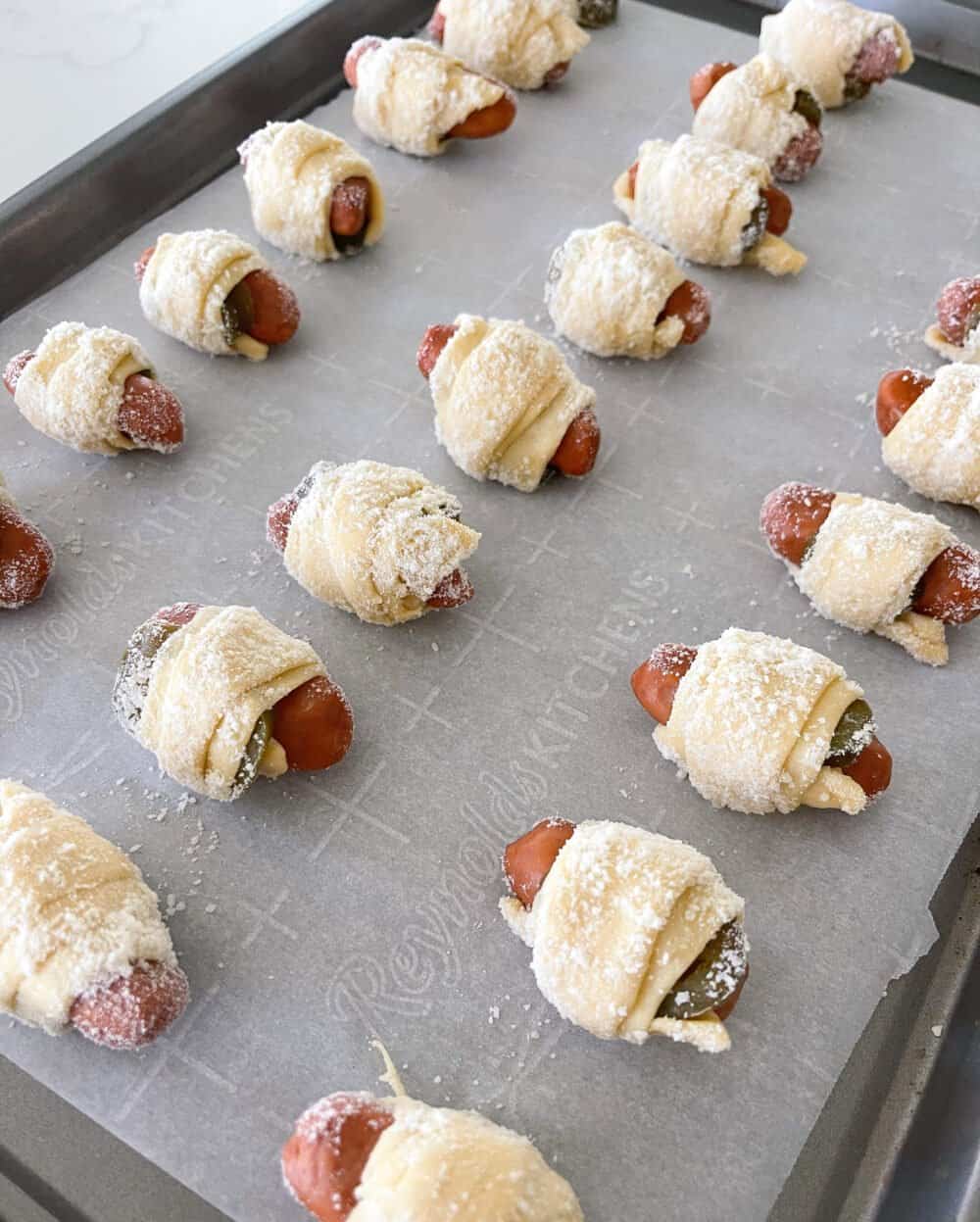 pigs in a blanket on baking sheet ready to bake