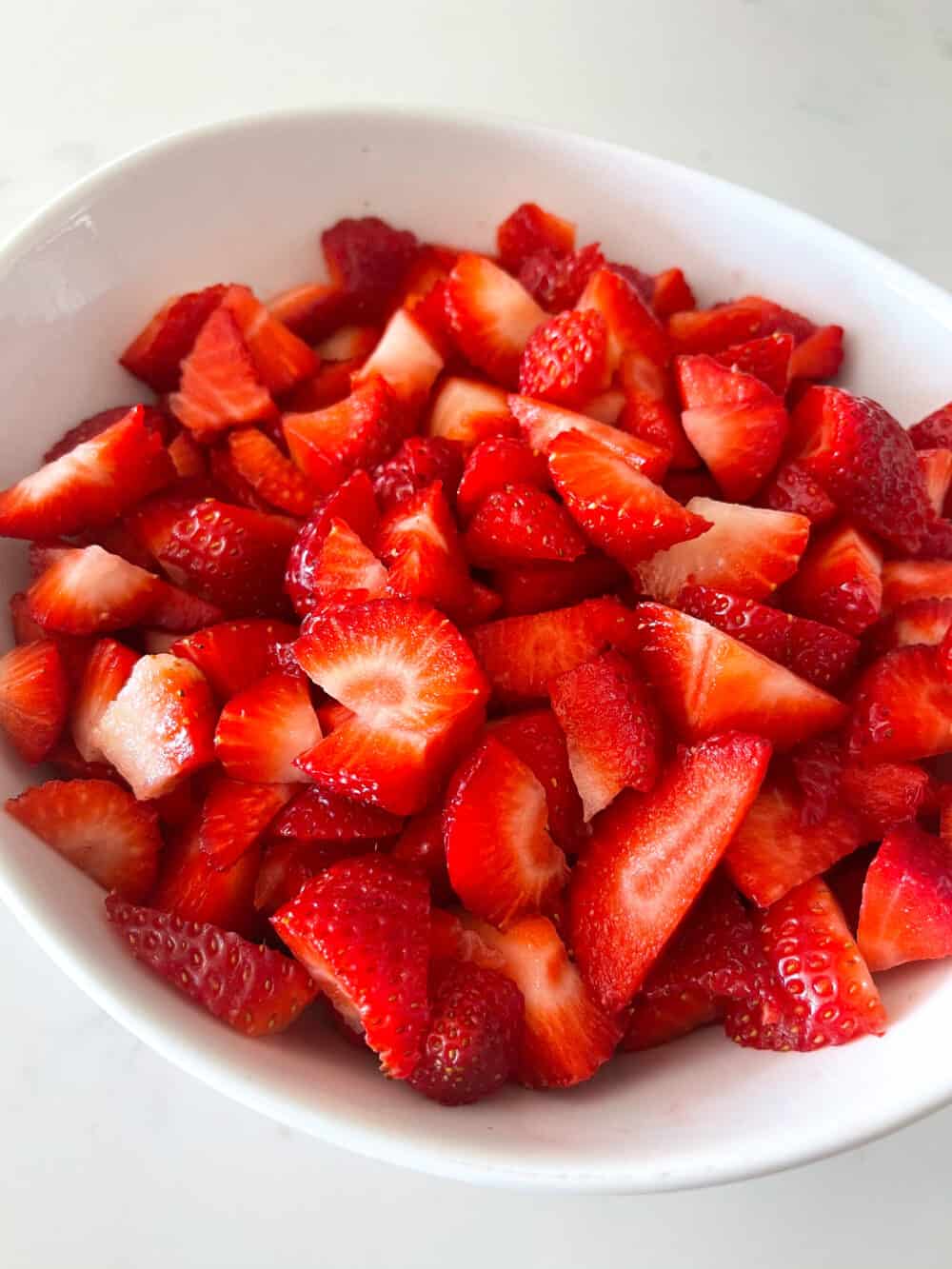 chopped strawberries in bowl