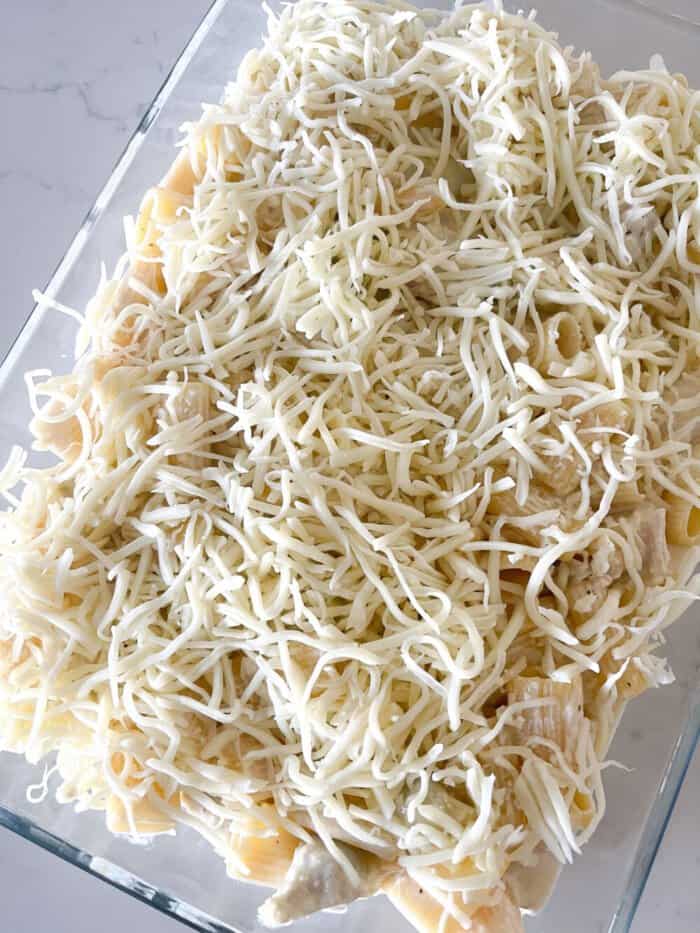 shredded cheese over pasta