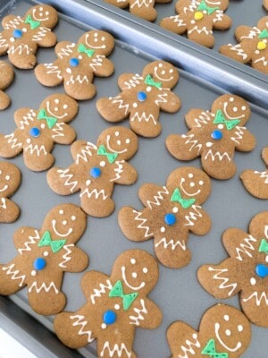 gingerbread man cookies decorated on baking sheets
