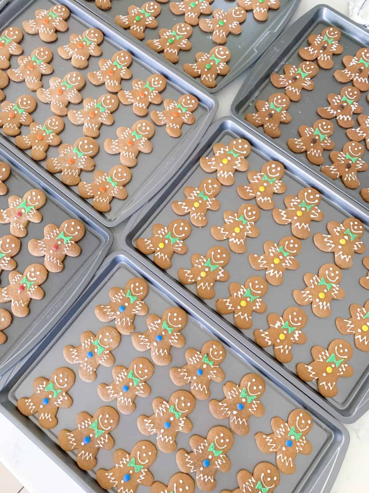 gingerbread man cookies decorated on baking sheets