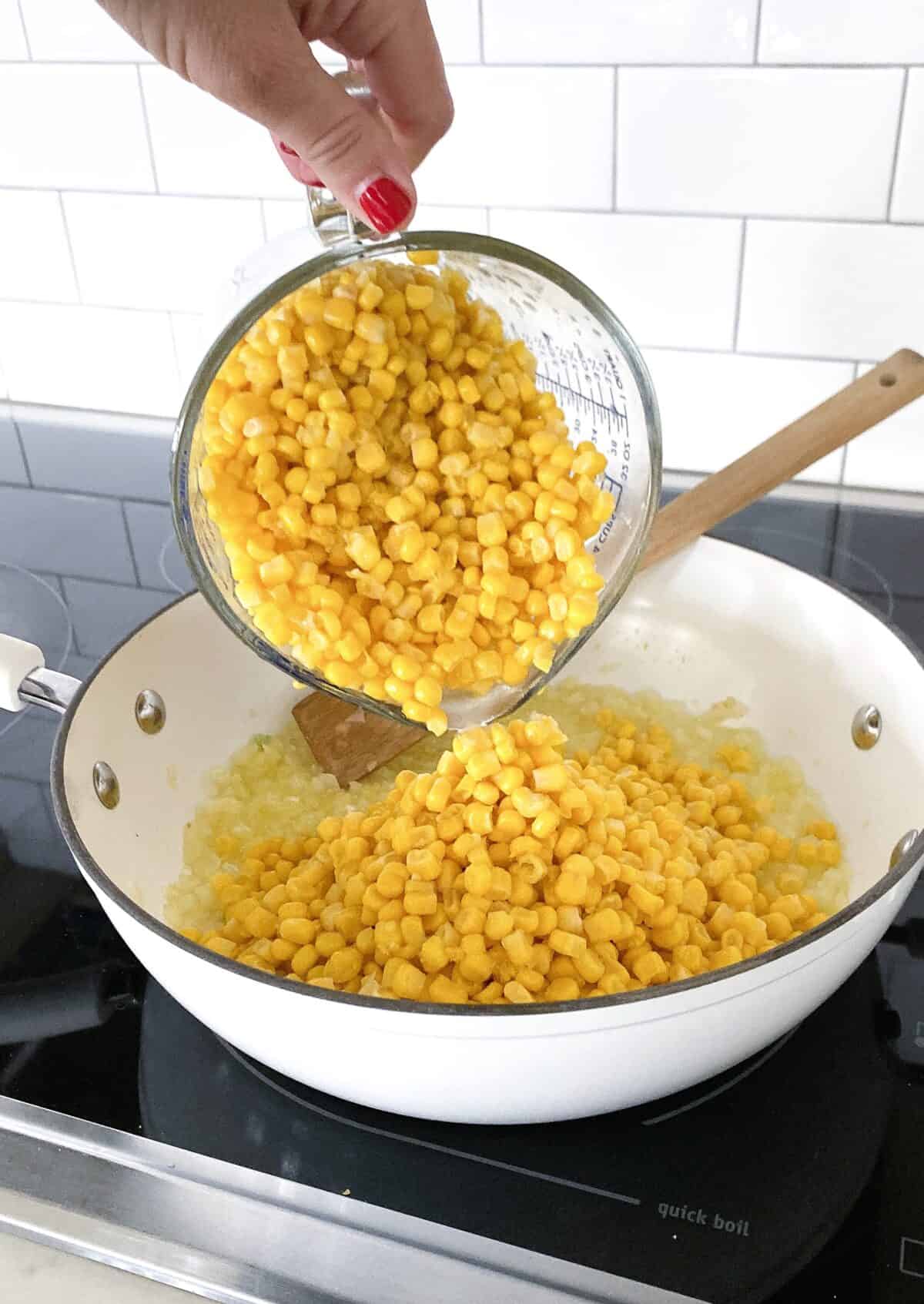 pouring corn in skillet
