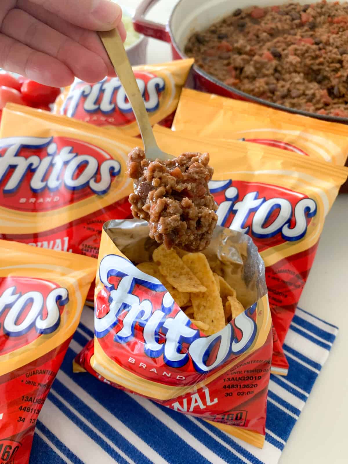 adding meat to fritos for walking taco