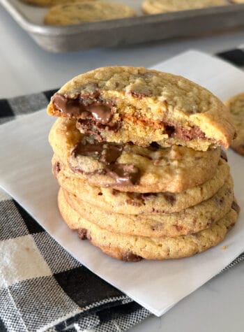 chewy chocolate chip cookies stacked and cut in half