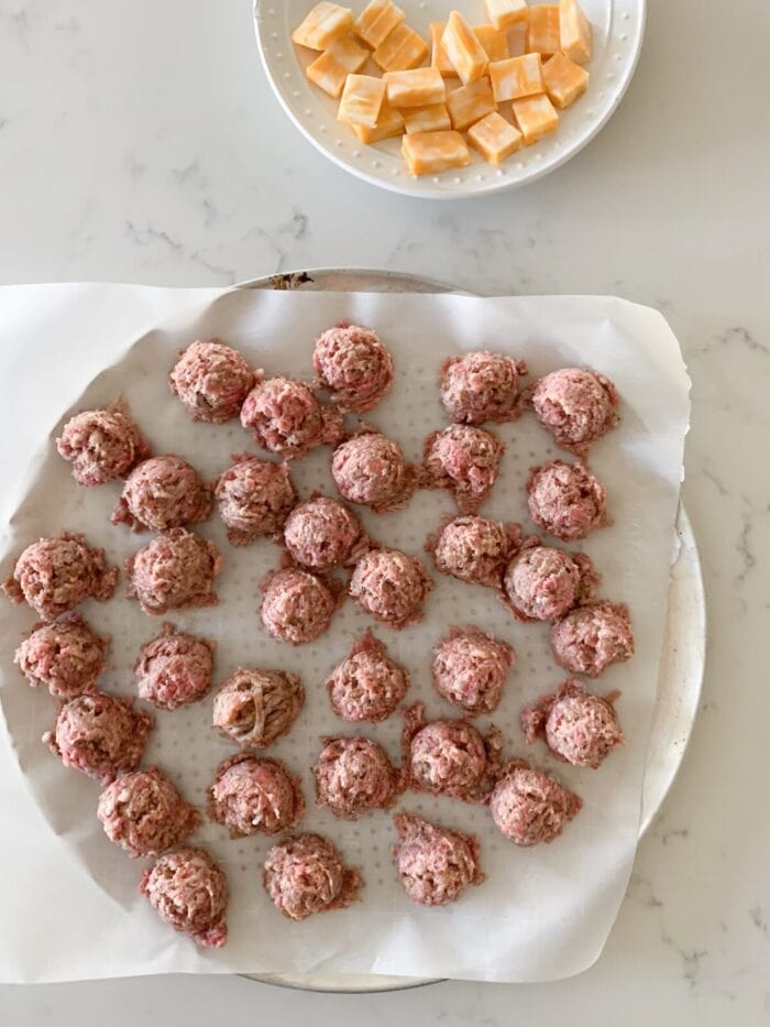meatballs rolled onto parchment paper