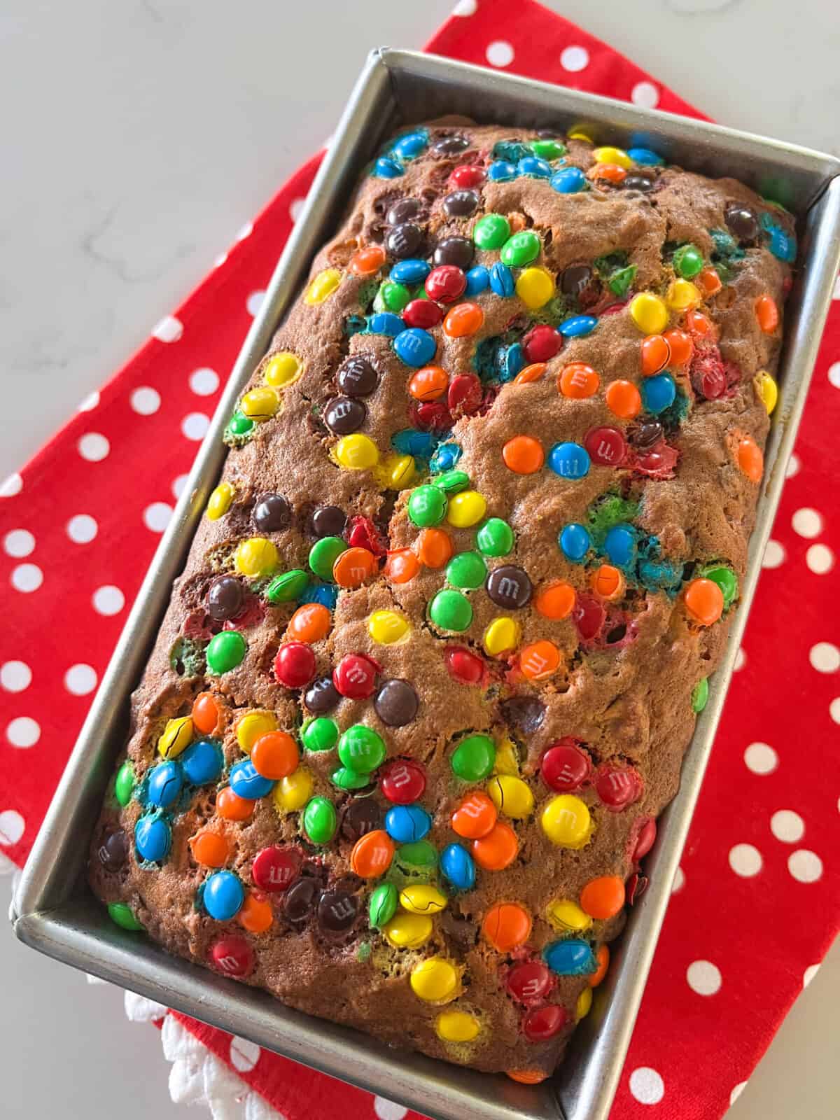 baked M & M Banana Bread in loaf pan