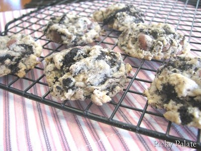 Oreo chocolate chip cookies on a wire rack.