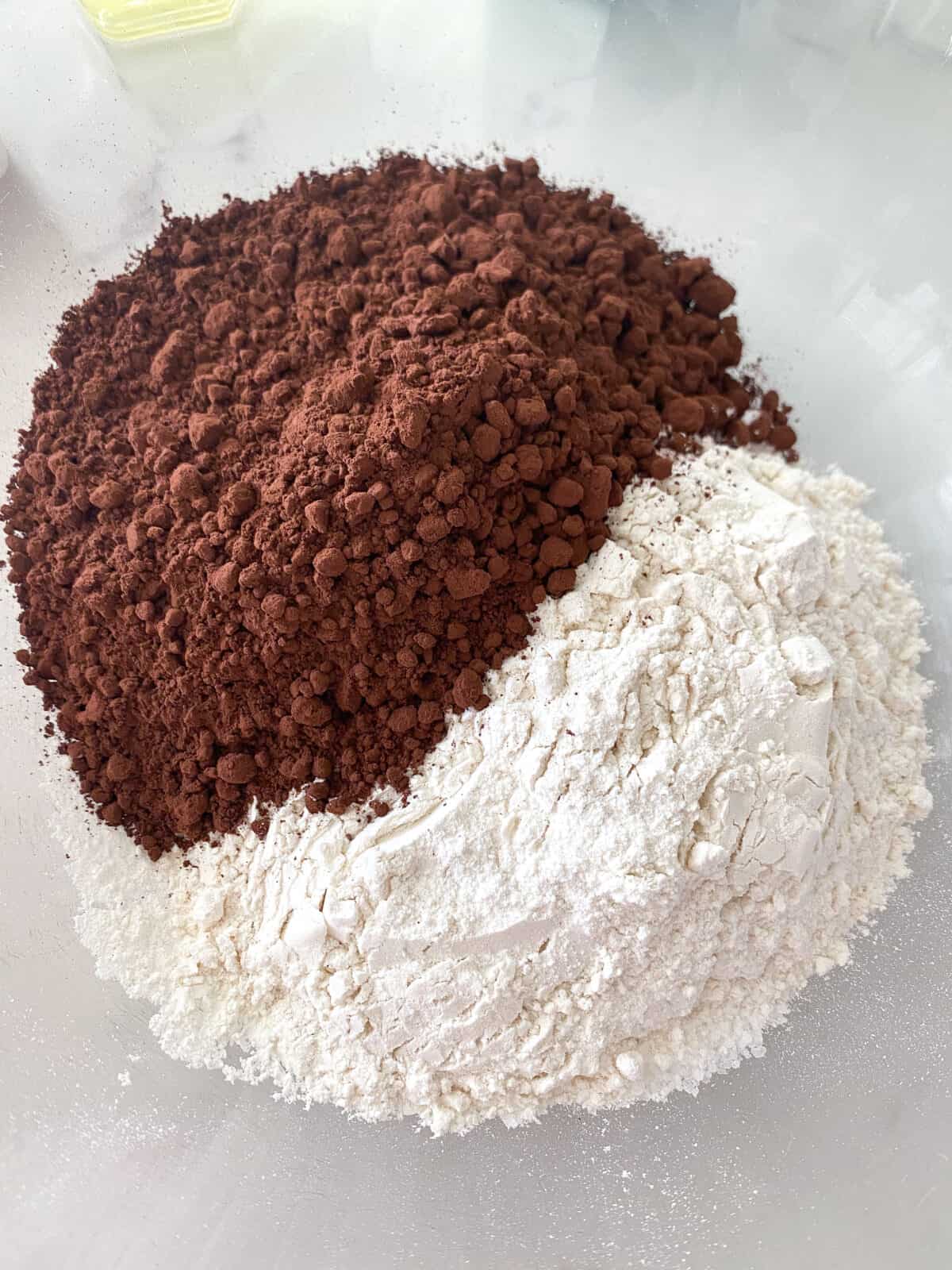cocoa powder and flour in mixing bowl for homemade brownies