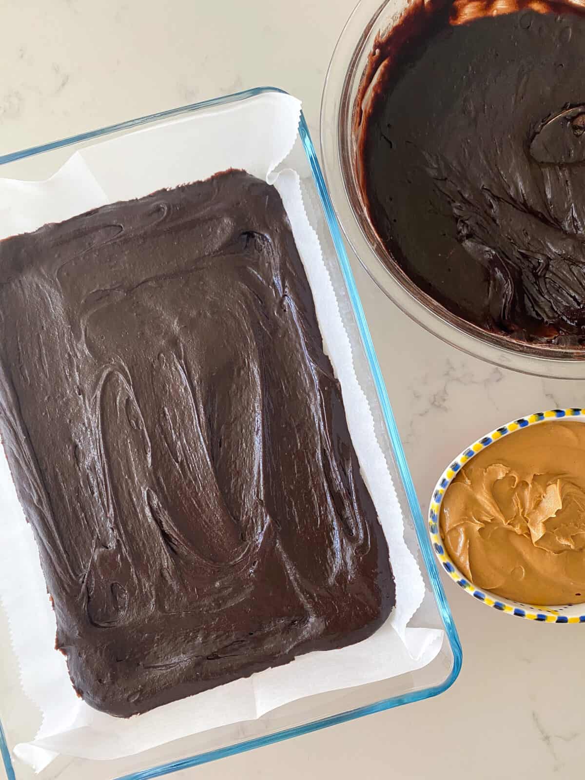 brownie batter added to baking dish