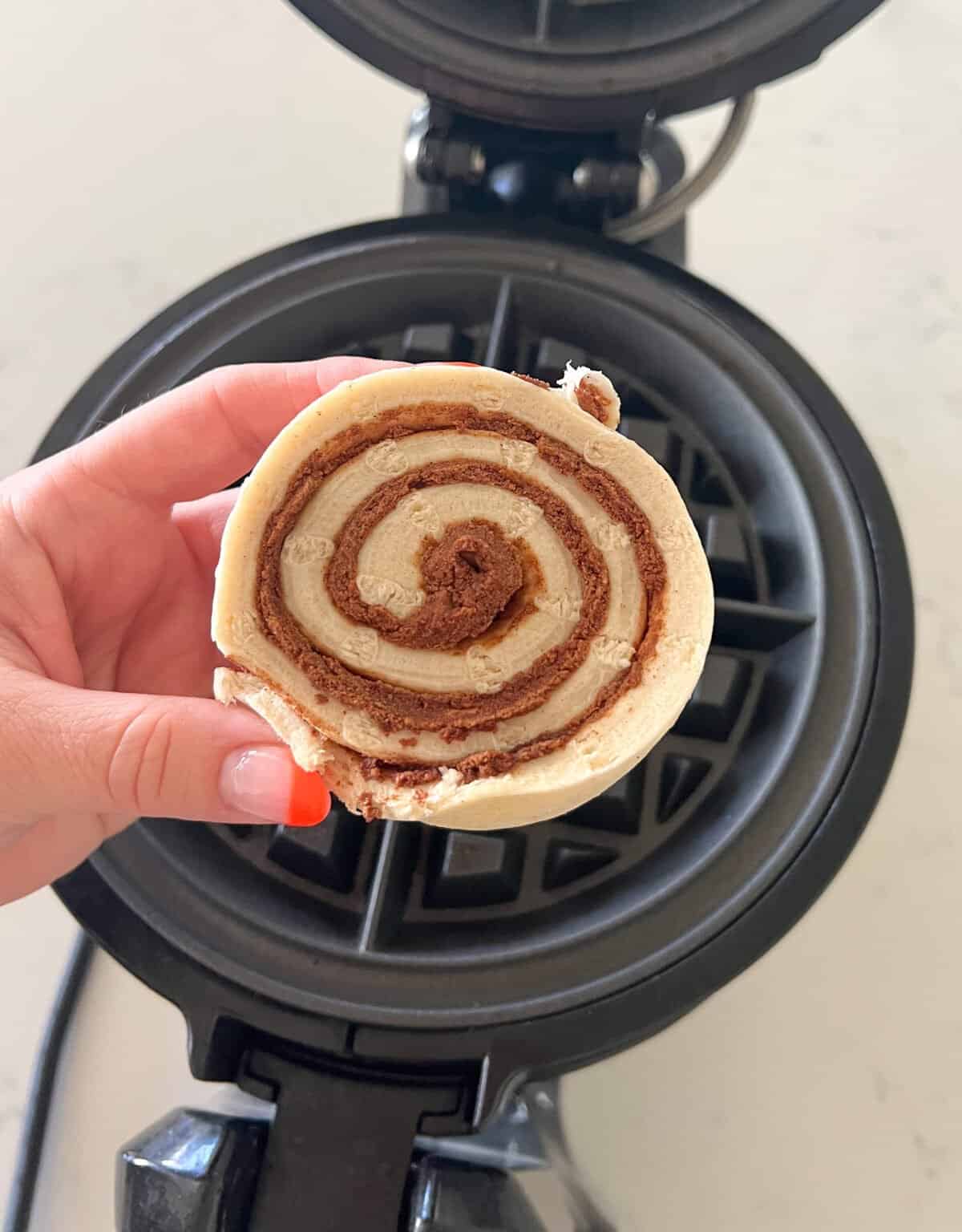 cinnamon roll before getting cooked in waffle maker