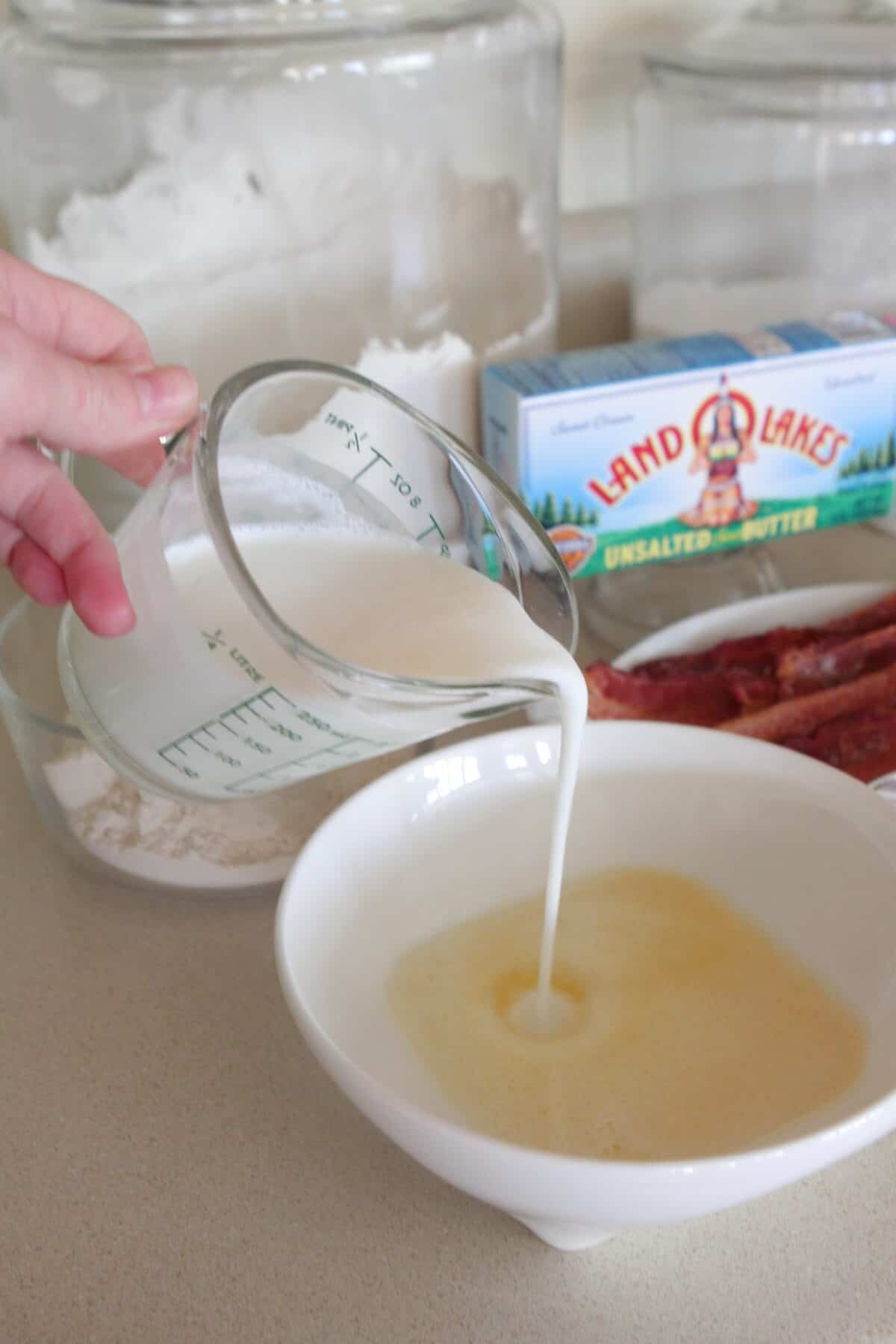 adding buttermilk to melted butter