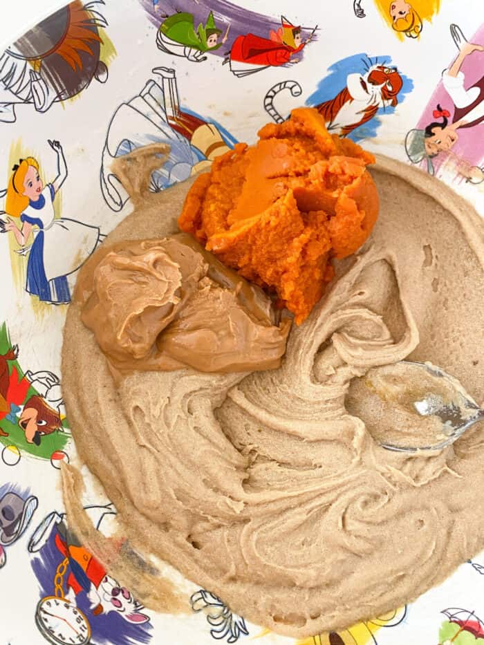 pumpkin and peanut butter added to mixing bowl