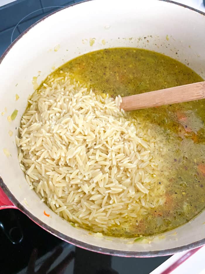 cooked orzo added to soup pot